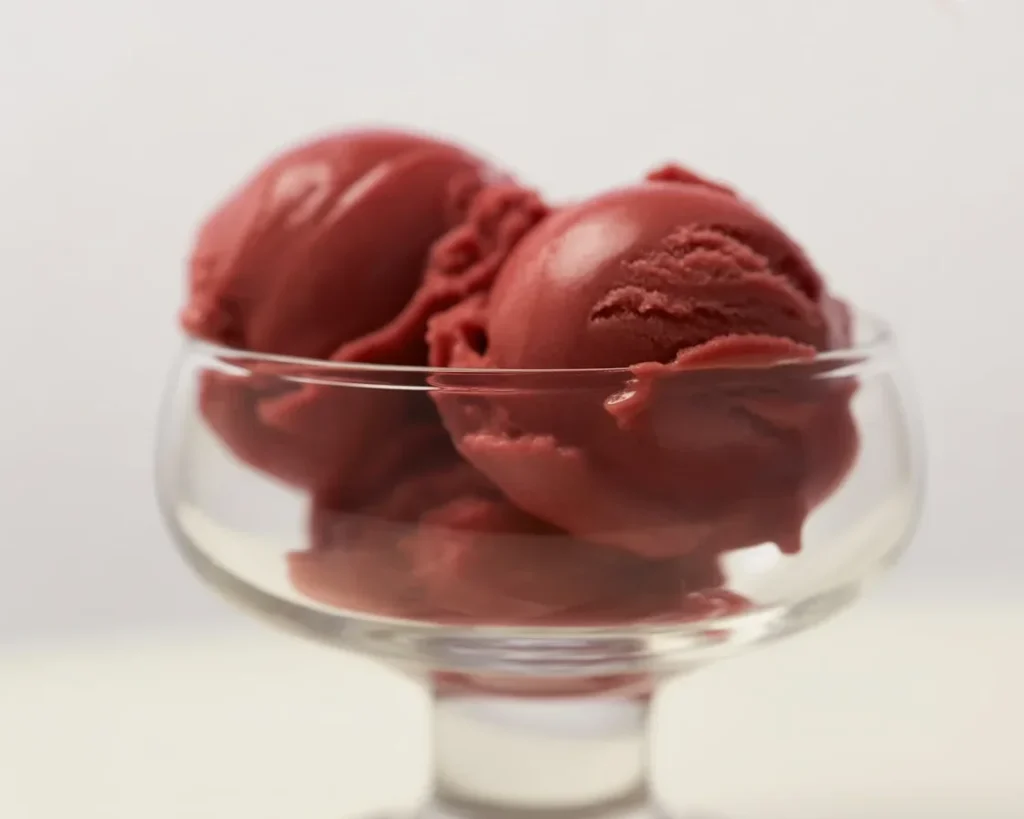 Ninja Creami Blueberry Lemon Sorbet garnished with fresh blueberries and lemon slices.