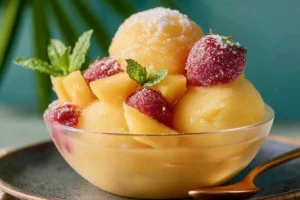 Delicious and colorful Frozen Fruit Sorbet served in a bowl with fresh fruit garnish
