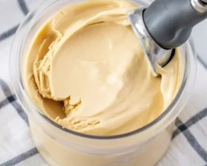 Delicious Ninja Creami peanut butter ice cream topped with peanut butter swirls.