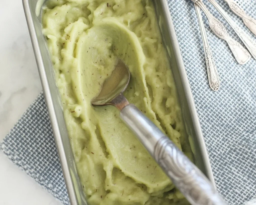Delicious homemade kiwi sorbet featuring vibrant green kiwi fruit.