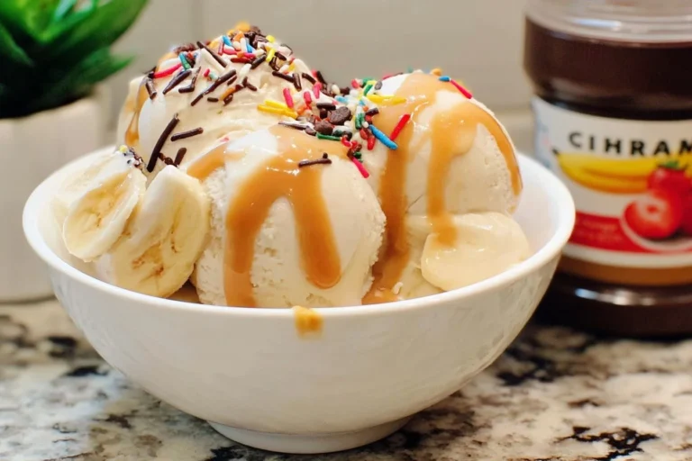 Delicious banana split ice cream with bananas and toppings