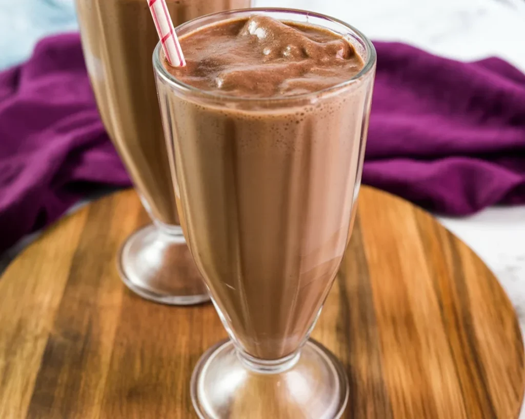 Ninja Slushi Chocolate Milkshake topped with chocolate syrup and whipped cream