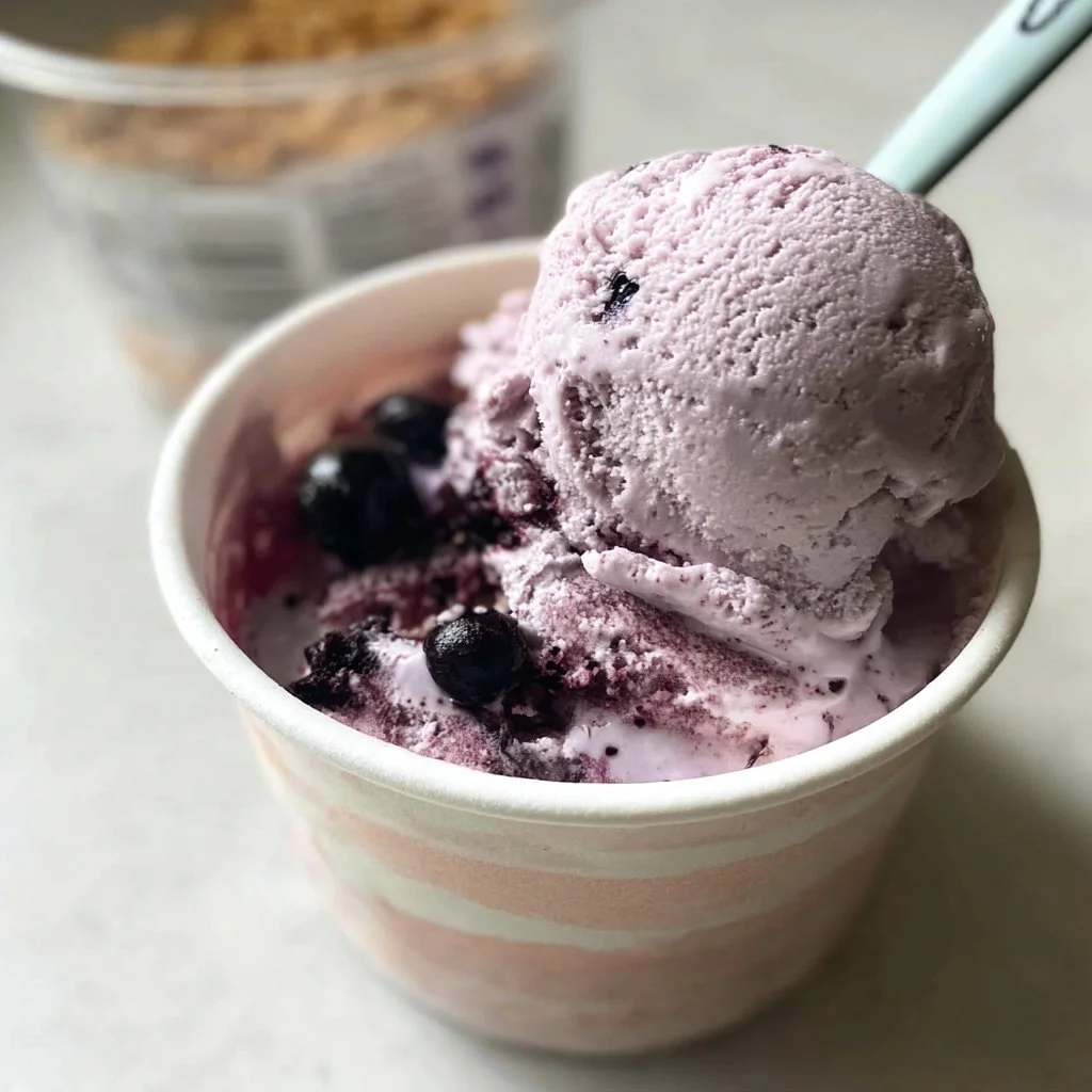 Creamy blueberry cheesecake ice cream served in a bowl