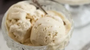 Creamy London Fog Ice Cream in a bowl with tea and lavender flowers