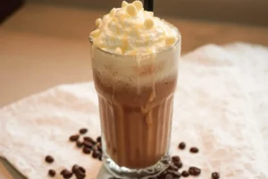 Delicious Iced White Chocolate Mocha with whipped cream and chocolate drizzle