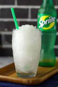 Ninja Creami Sprite Slushie in a colorful cup with ice and garnishes