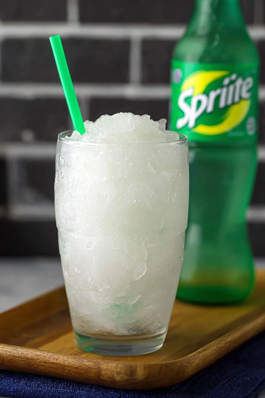 Ninja Creami Sprite Slushie in a colorful cup with ice and garnishes