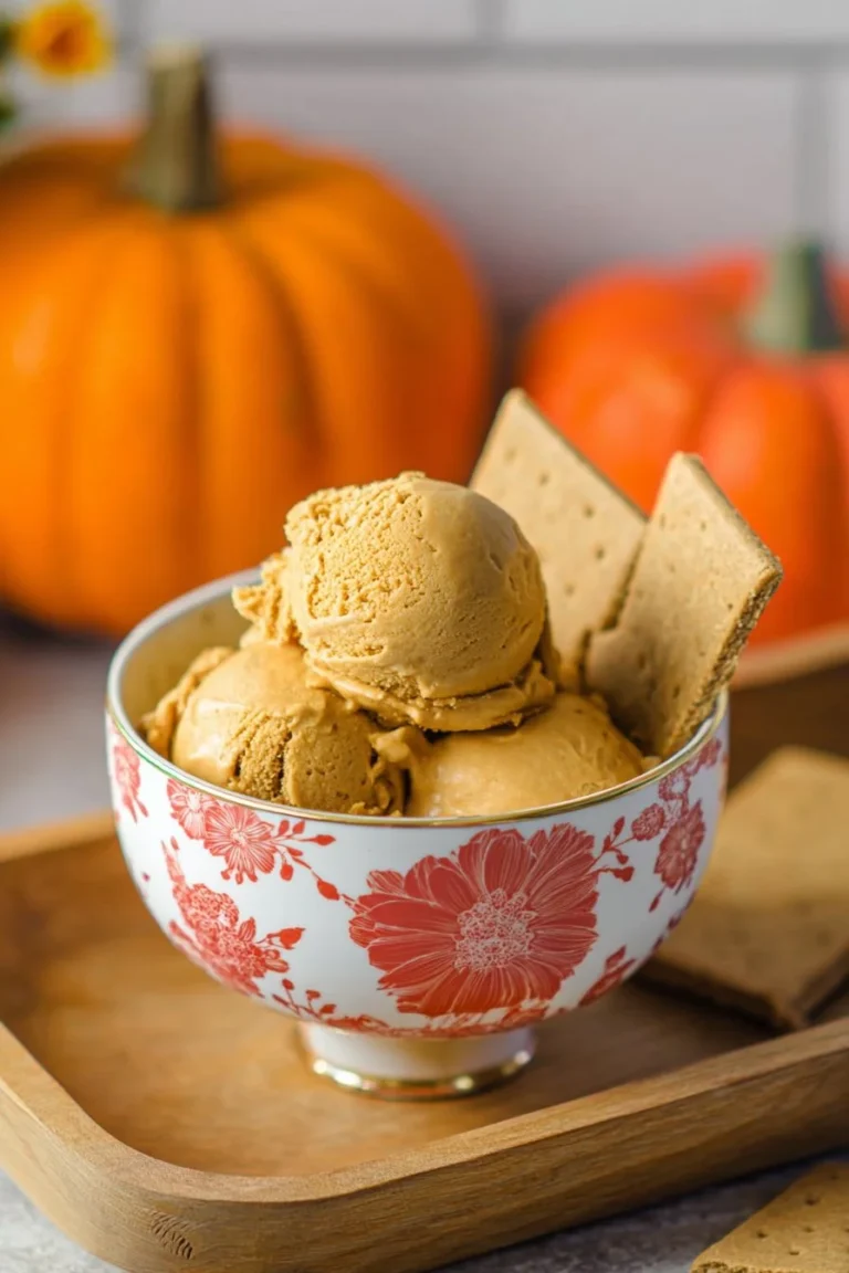 Ninja Creami Vegan Pumpkin Pie Protein Ice Cream in a bowl with a spoon