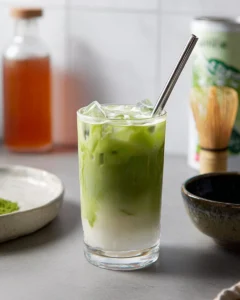 Delicious Apple Matcha Latte topped with apple slices and whipped cream